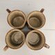 Set of 4 ceramic mugs, glazed stoneware, assorted vintage designs.