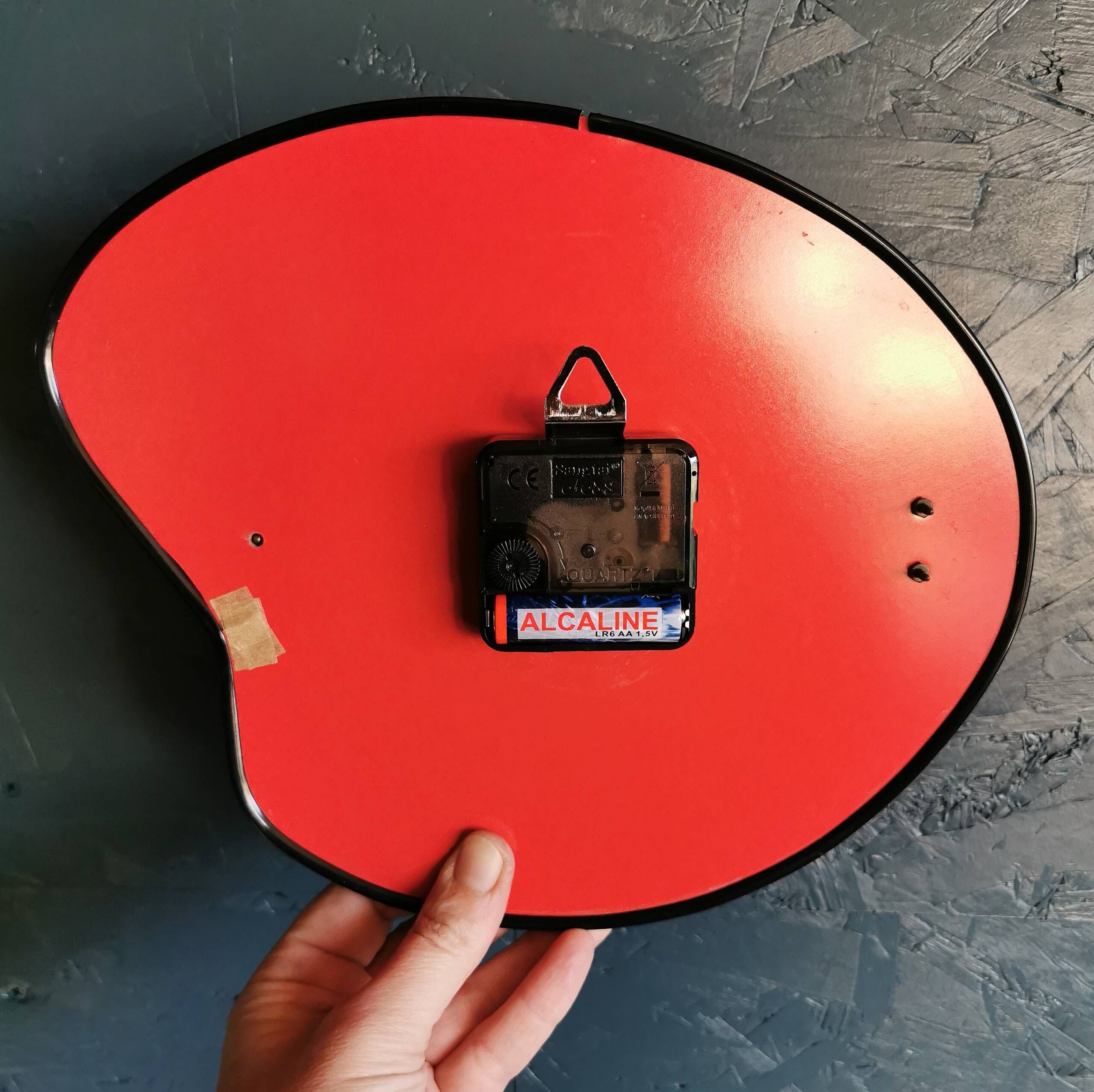 Vintage formica clock silent asymmetrical wall pendulum "Doby Matic red"
