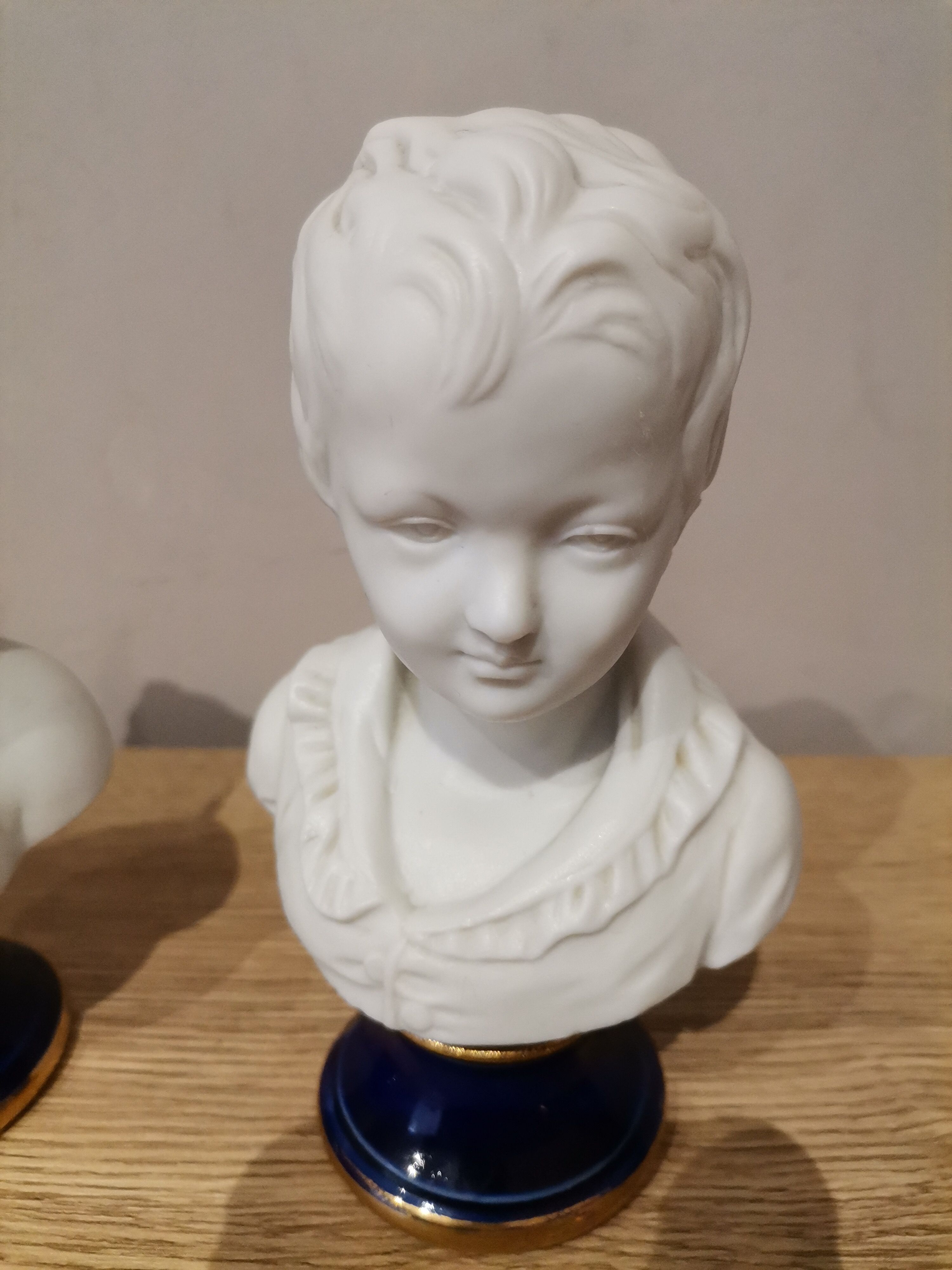 Signed children's busts