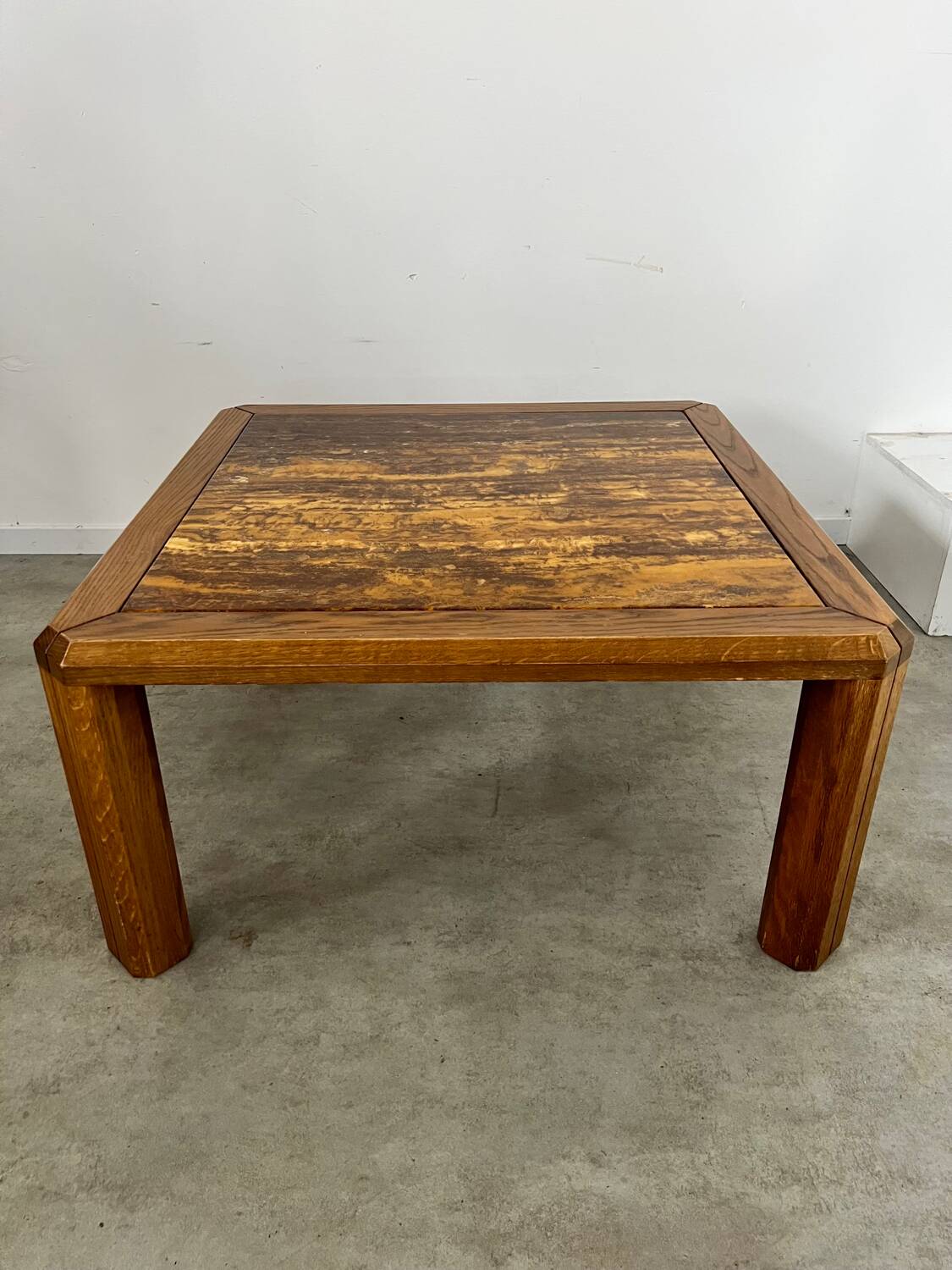 Old coffee table with golden marble top, 70s design, vintage wooden feet