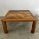 Old coffee table with golden marble top, 70s design, vintage wooden feet