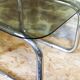 Chrome metal and smoked glass side table.