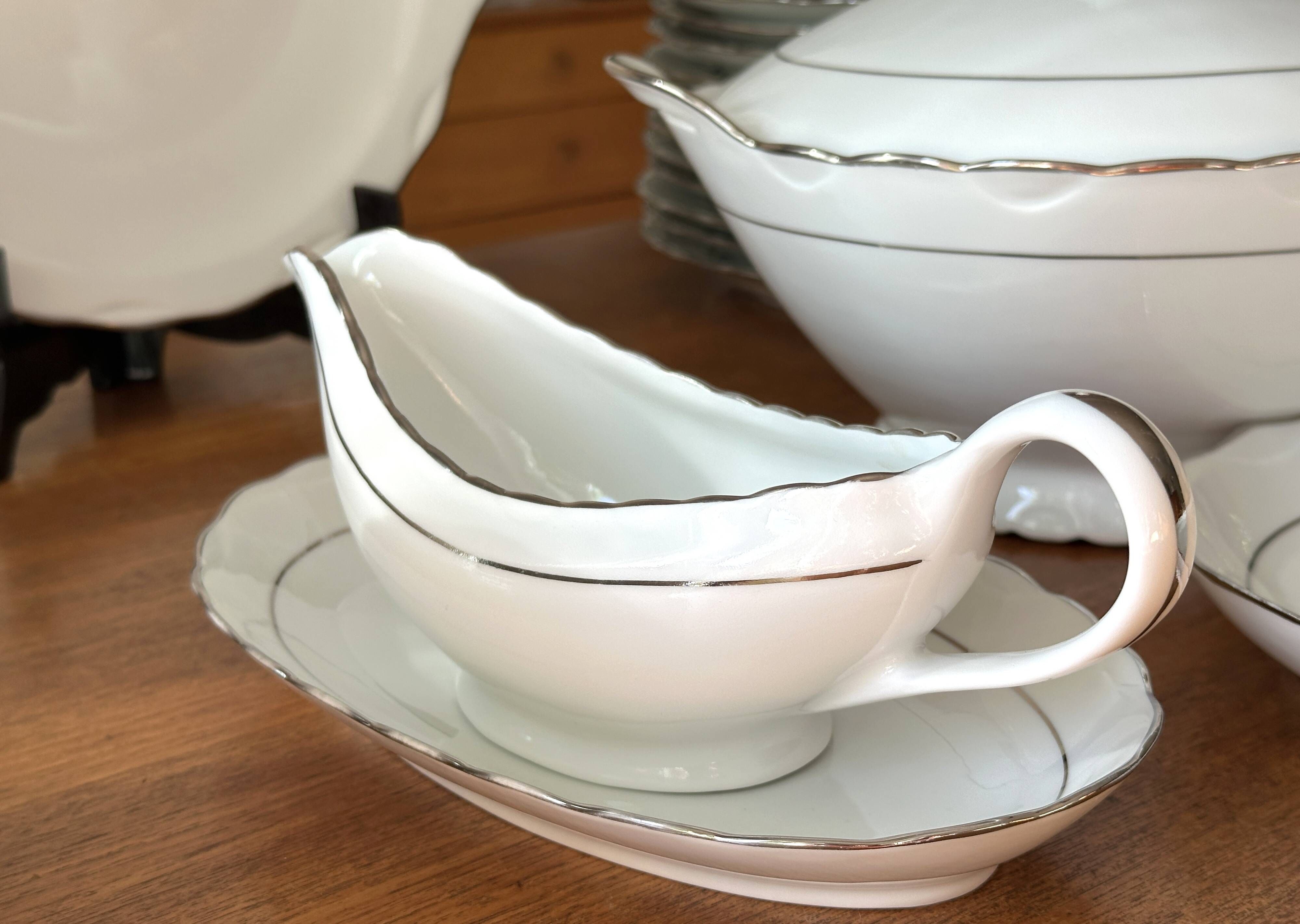 White and silver table service, Limoges porcelain, 56 pieces - in good condition.