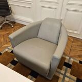 Two-seater sofa and a grey leather armchair Italia.