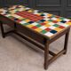 19th century oak farm table with multi-colored ceramic tiles