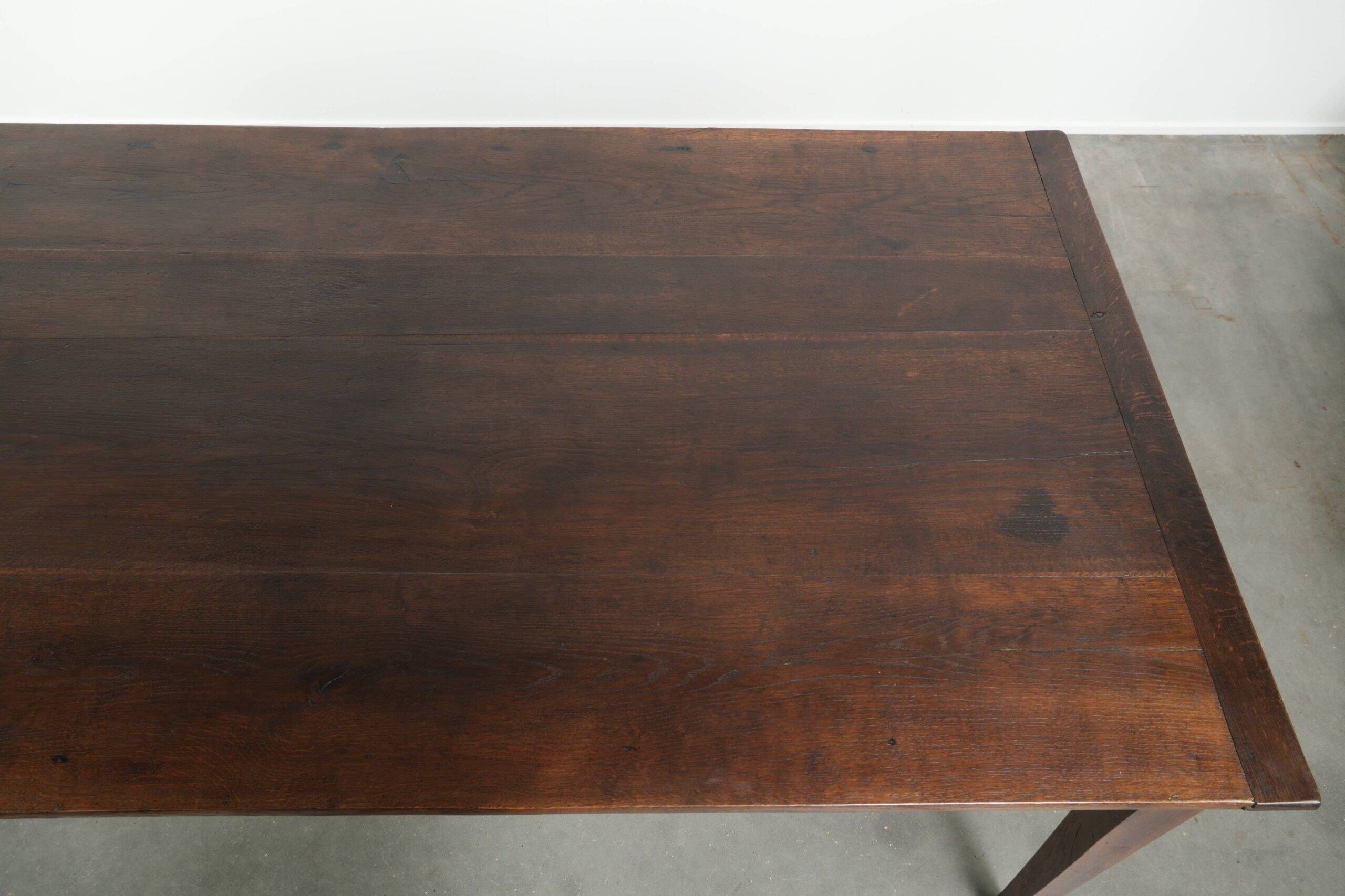 Antique French oak dining table from the early 19th century