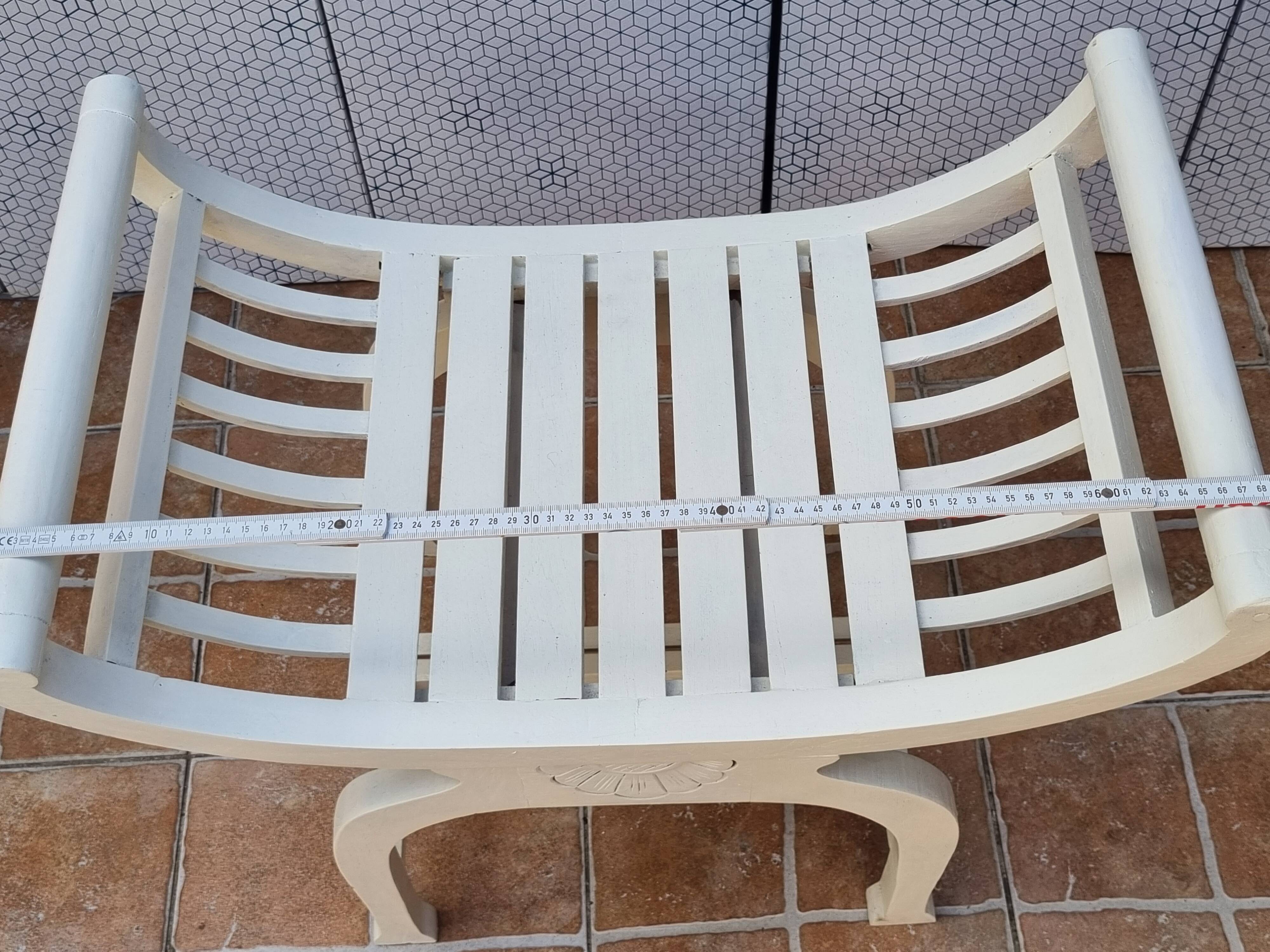 Curule stool in patinated carved wood, Manuel Canovas seat, 60 cm