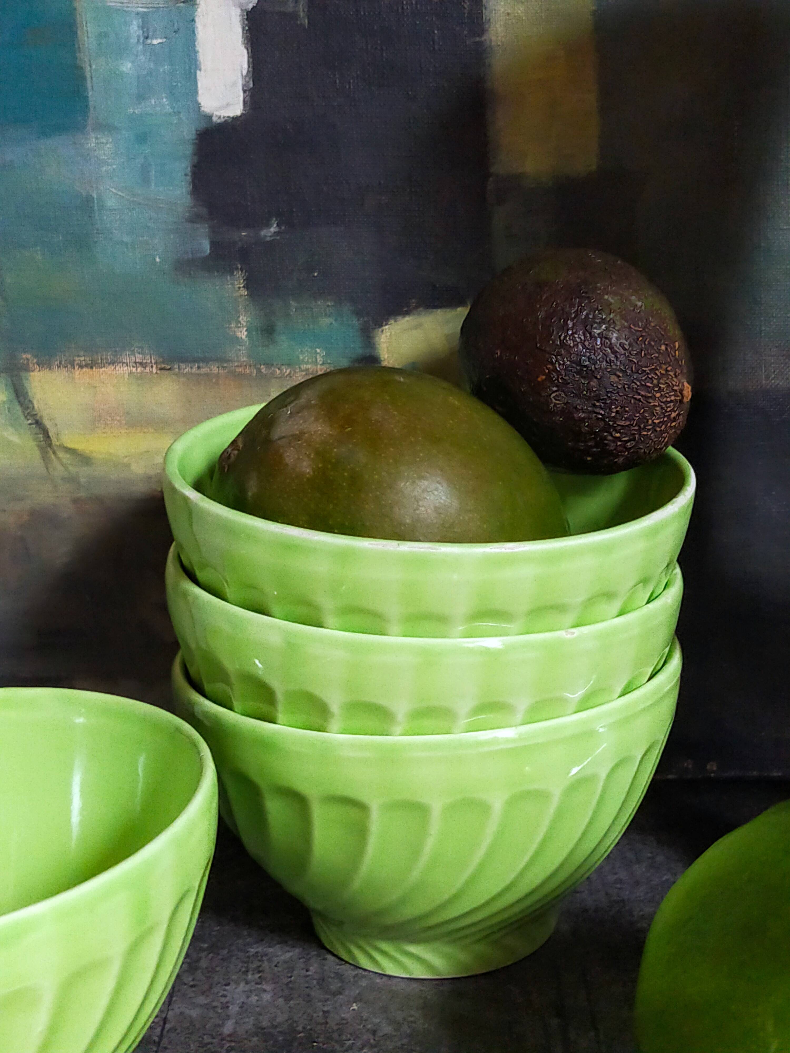 Four vintage spring green earthenware bowls