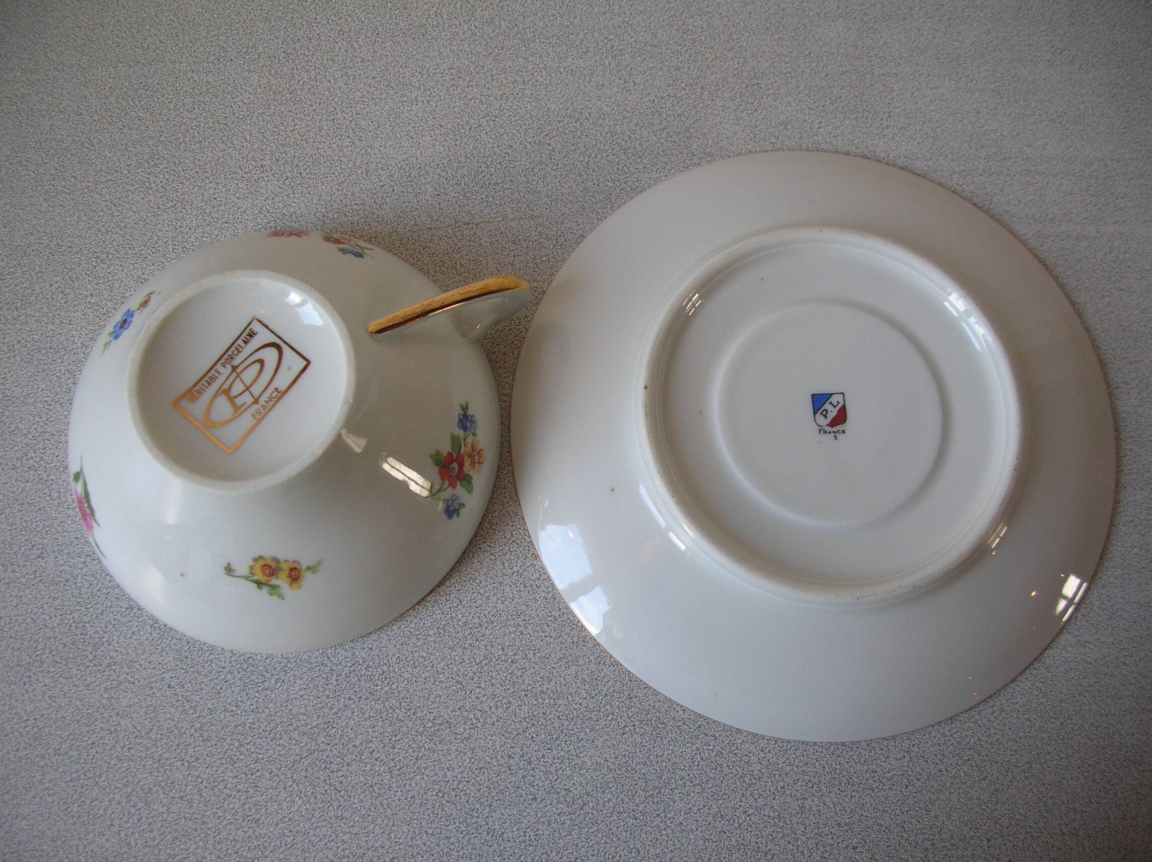 Old large tea cup and saucer in Limoges porcelain with flower decor