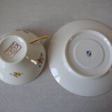 Old large tea cup and saucer in Limoges porcelain with flower decor