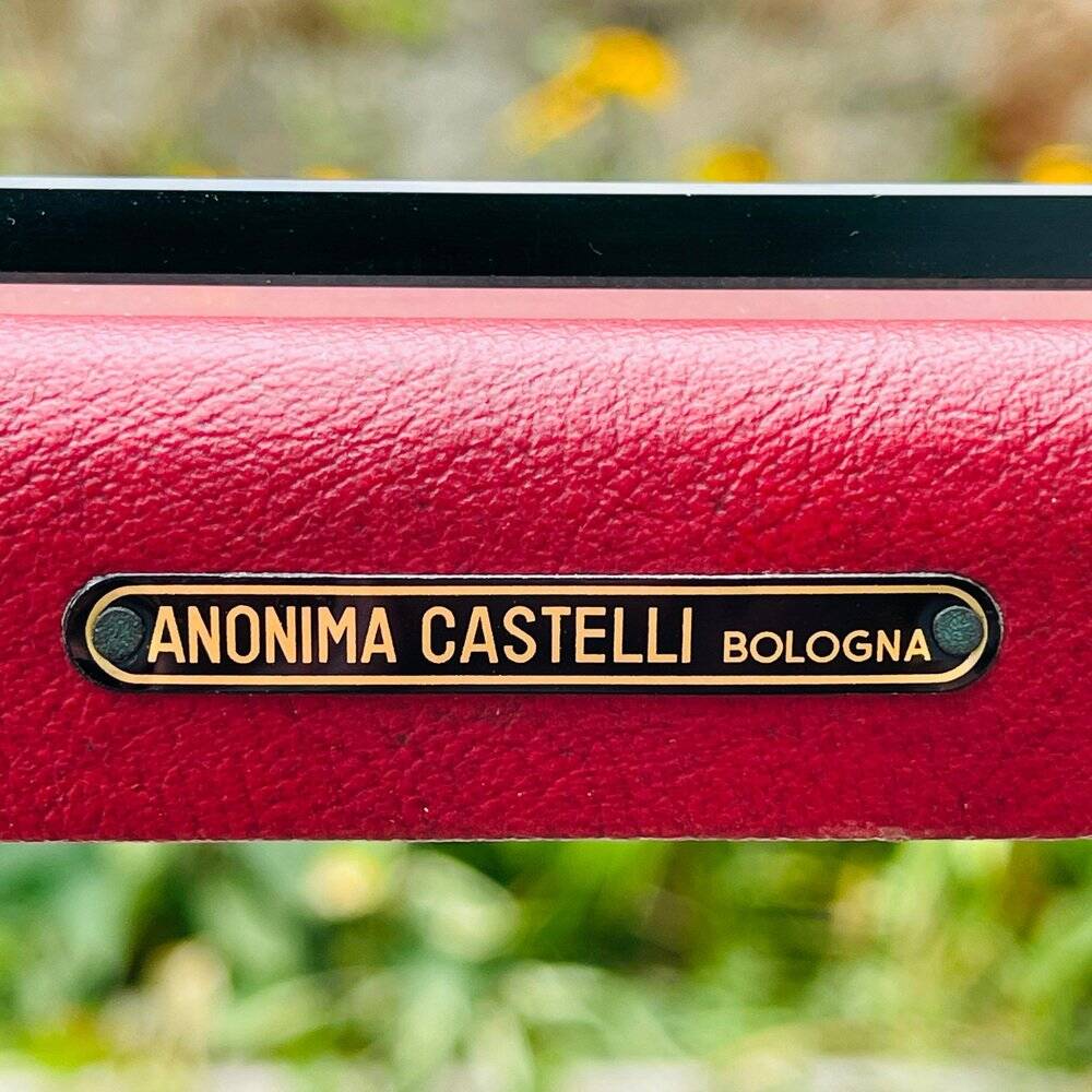 Chairs and coffee table by Anonima Castelli from Castelli / Anonima Castelli, Italy, 1950s, set of 3.