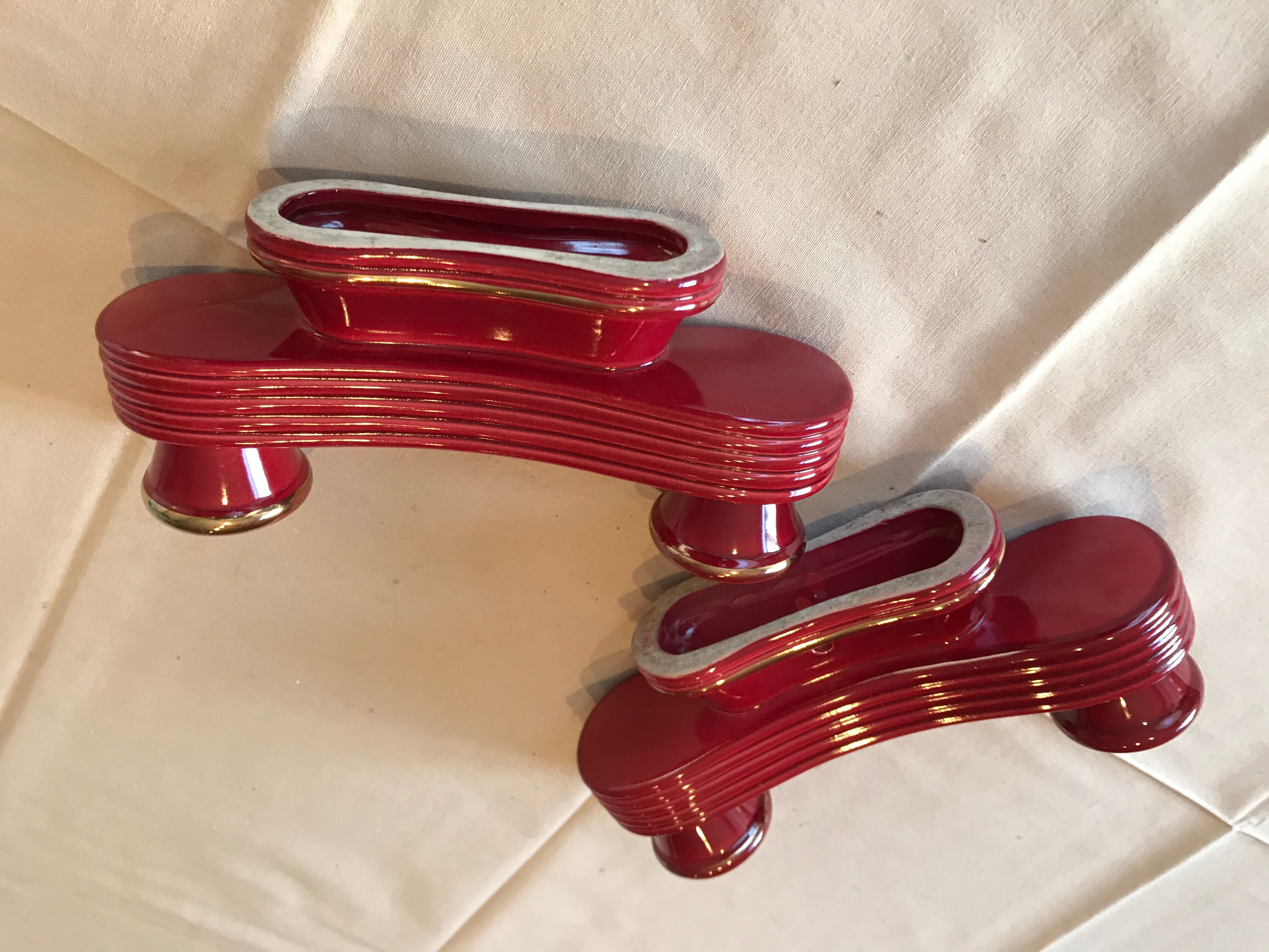 Two vintage raspberry candlesticks