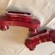 Two vintage raspberry candlesticks