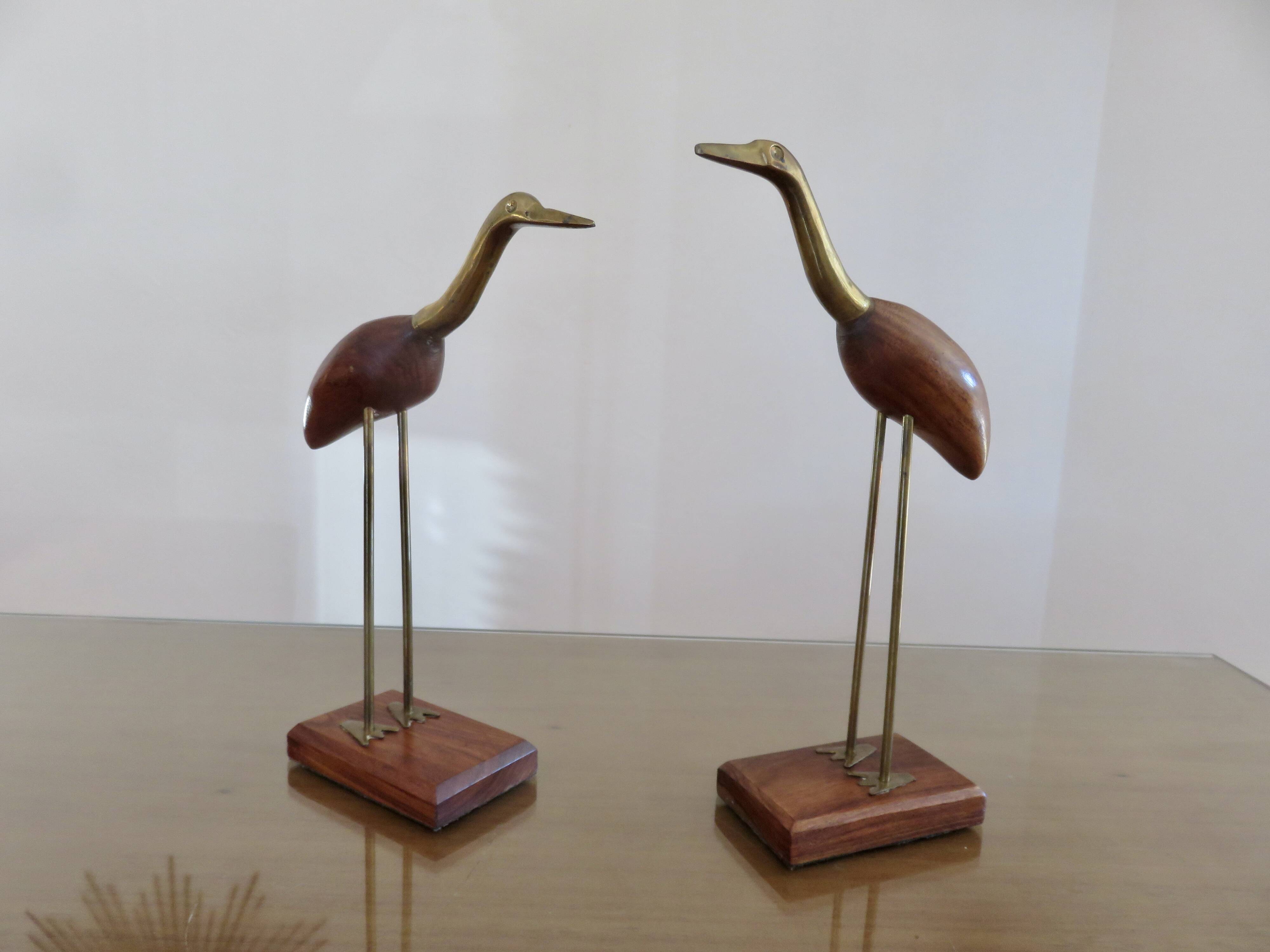Pair of teak and brass herons from the 70s