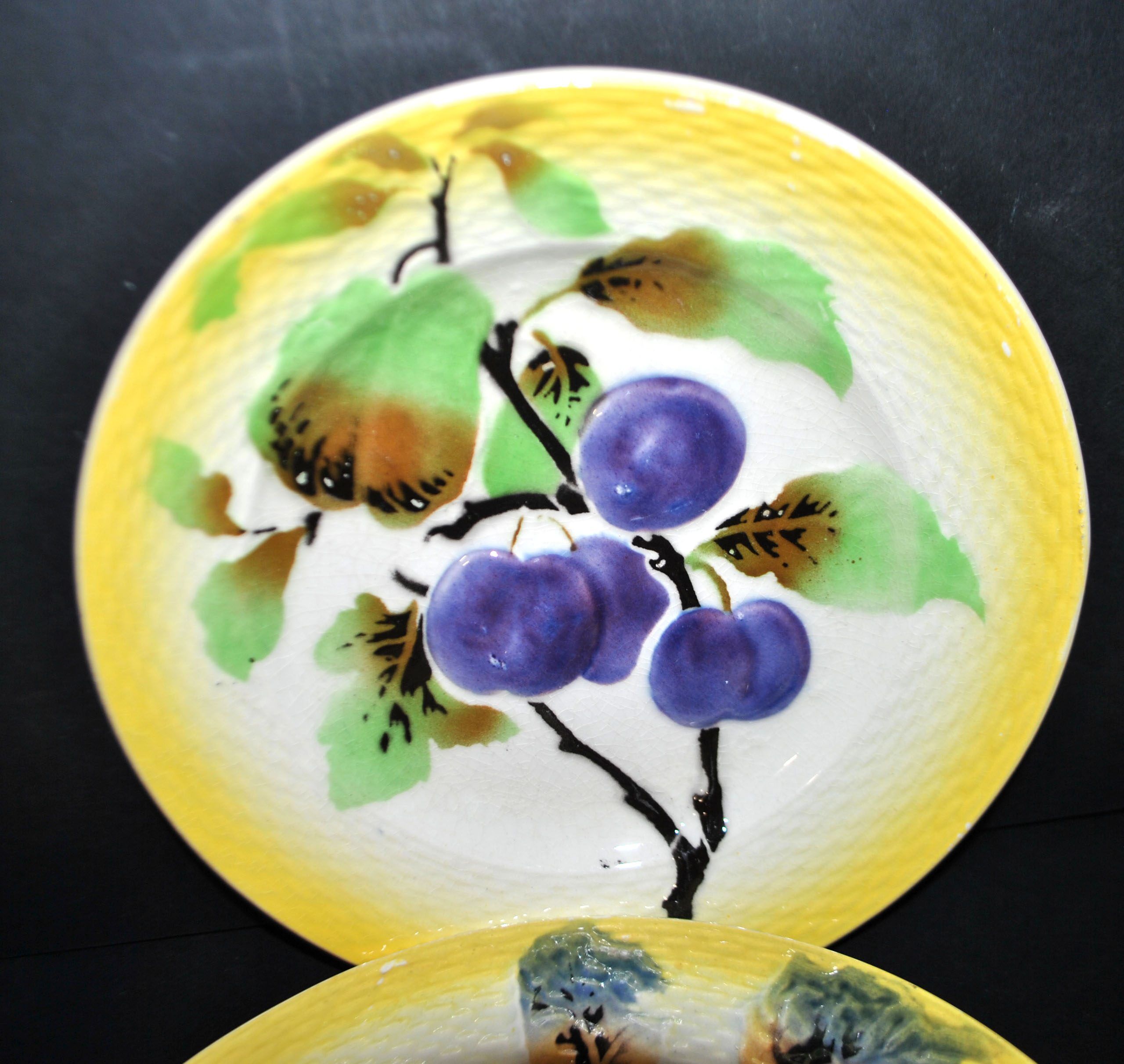 Orchies set of 6 yellow earthenware dessert plates with stencilled fruit decoration.