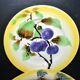 Orchies set of 6 yellow earthenware dessert plates with stencilled fruit decoration.