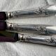 Set of 12 silver-plated metal table knives in Art Nouveau style.