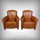 Paire de fauteuils club en cuir