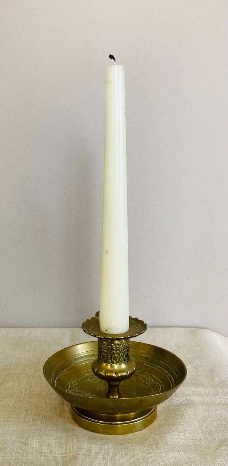 20th century chiseled brass socket candle holder representing Horsemen in armor