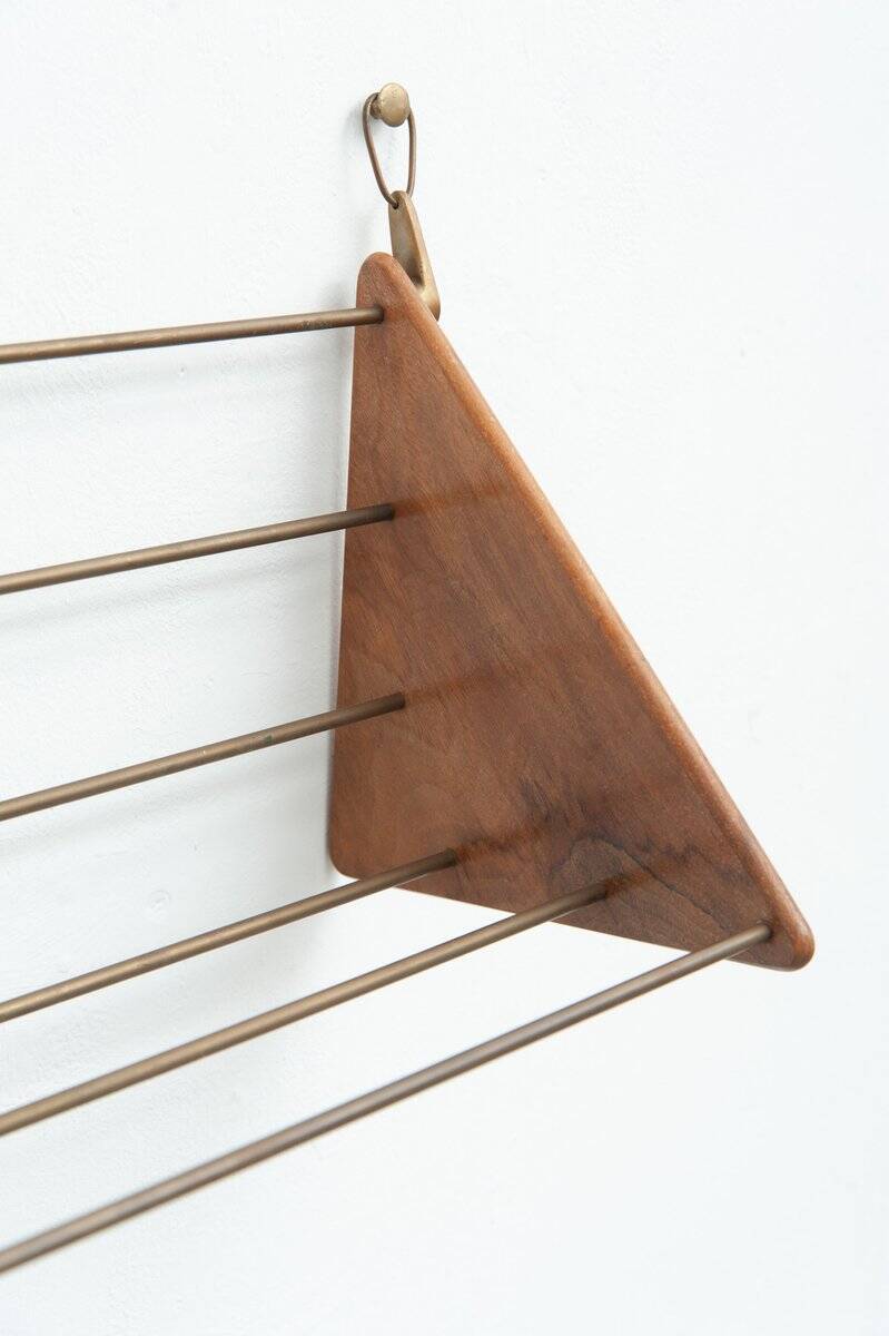 Wall-mounted walnut bookshelf by Carl Auböck, 1950s