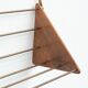Wall-mounted walnut bookshelf by Carl Auböck, 1950s