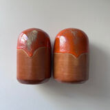 Salt and pepper shakers in orange stoneware