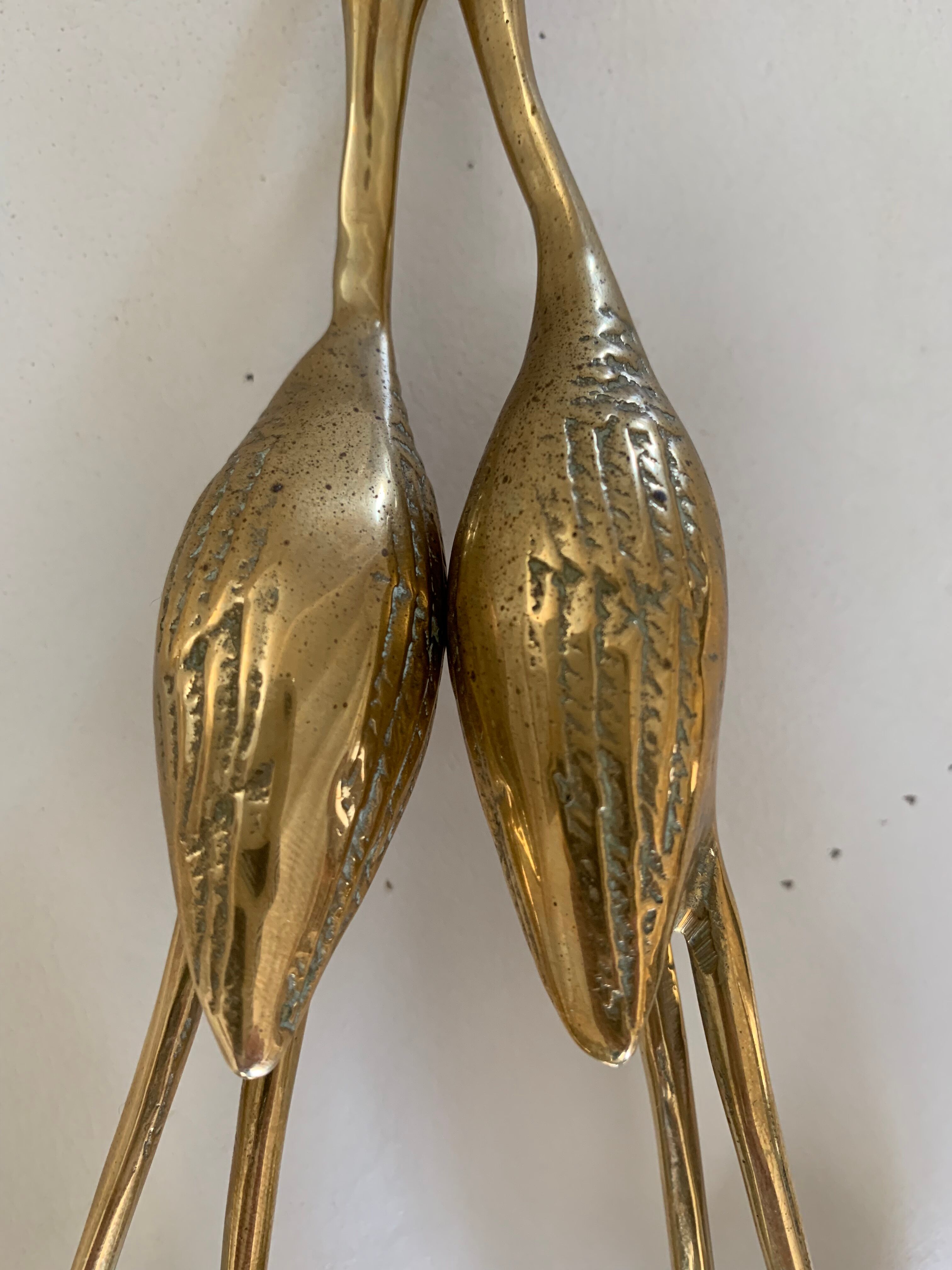 Brass heron duo