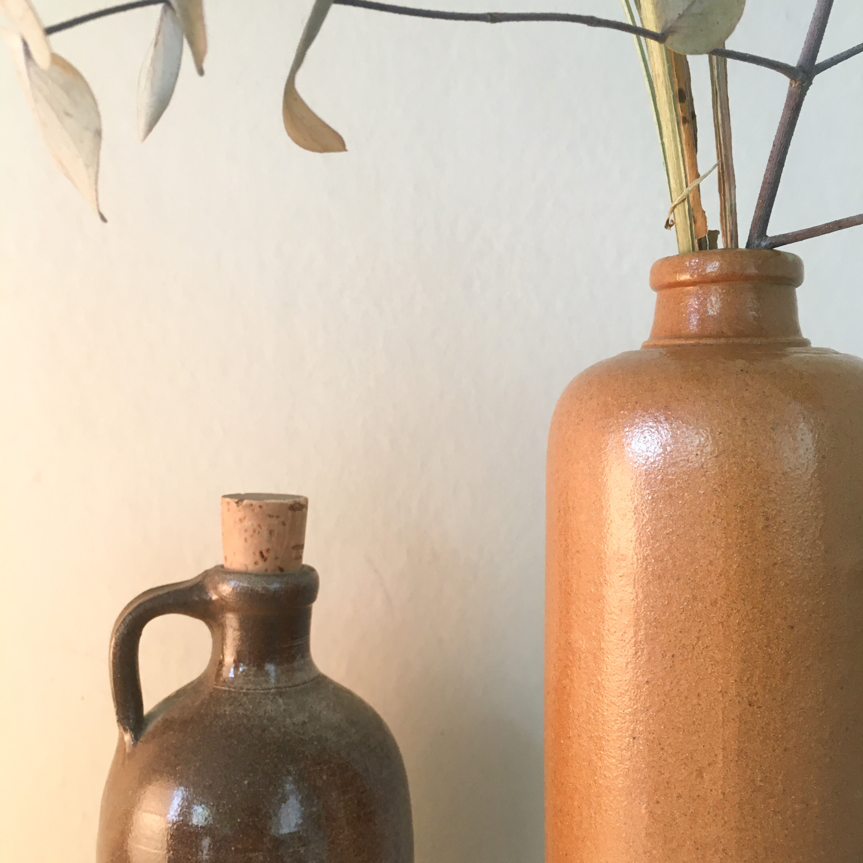 Duo of sandstone bottles