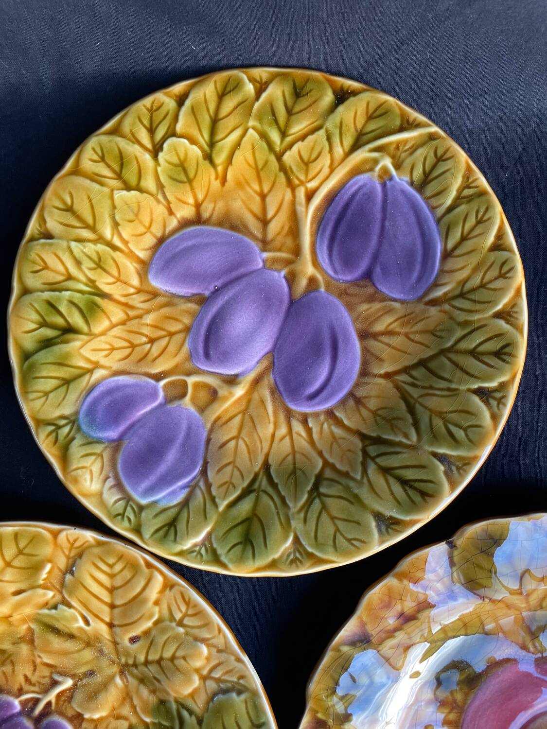 Set of four old Sarreguemines barbotine plates