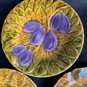 Together, four antique Sarreguemines barbotine plates.