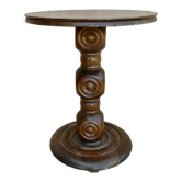 Pedestal table on carved wooden base