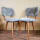 Pair of moumoute chairs with compass feet