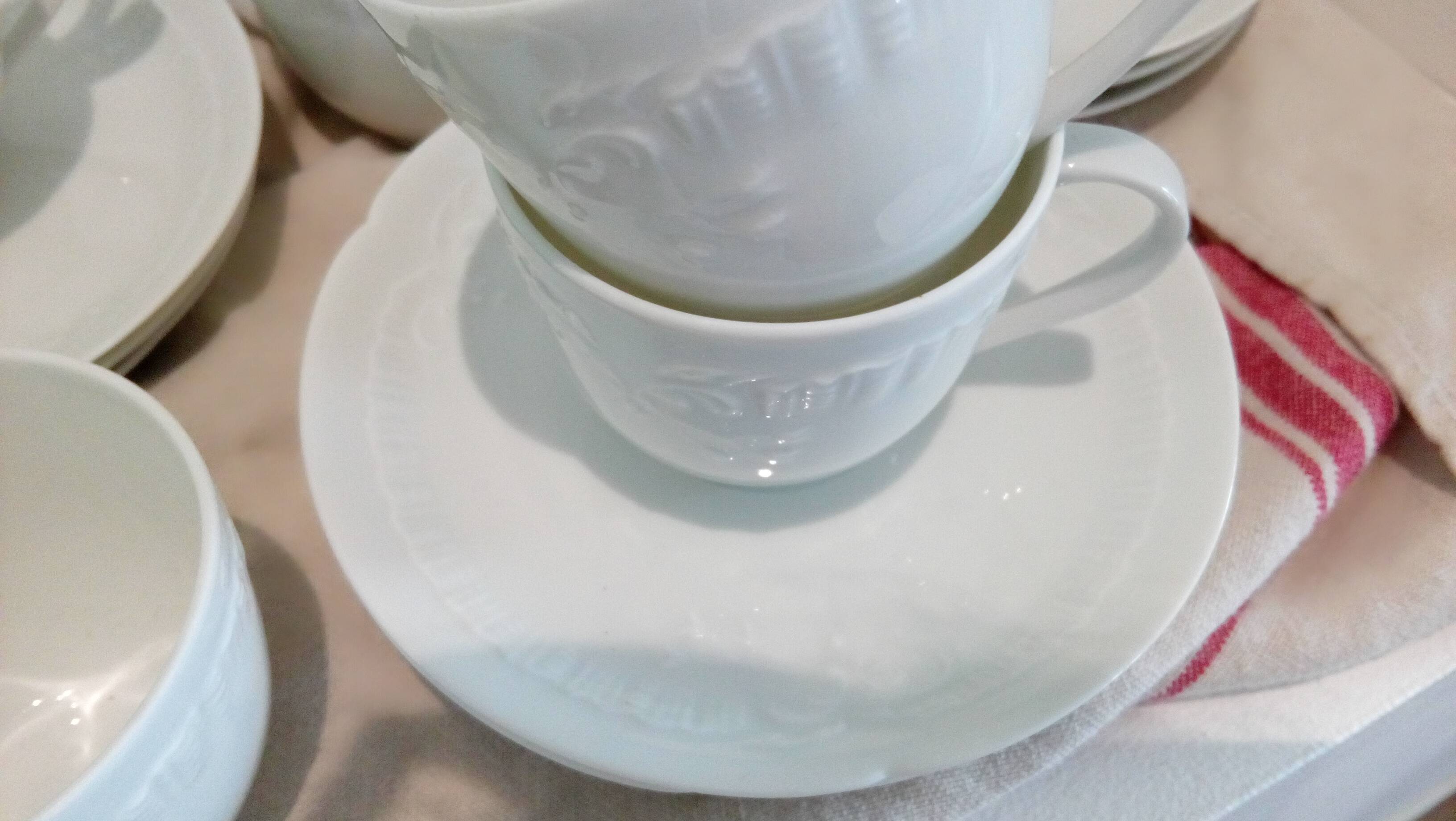 Set of 9 white porcelain coffee cups