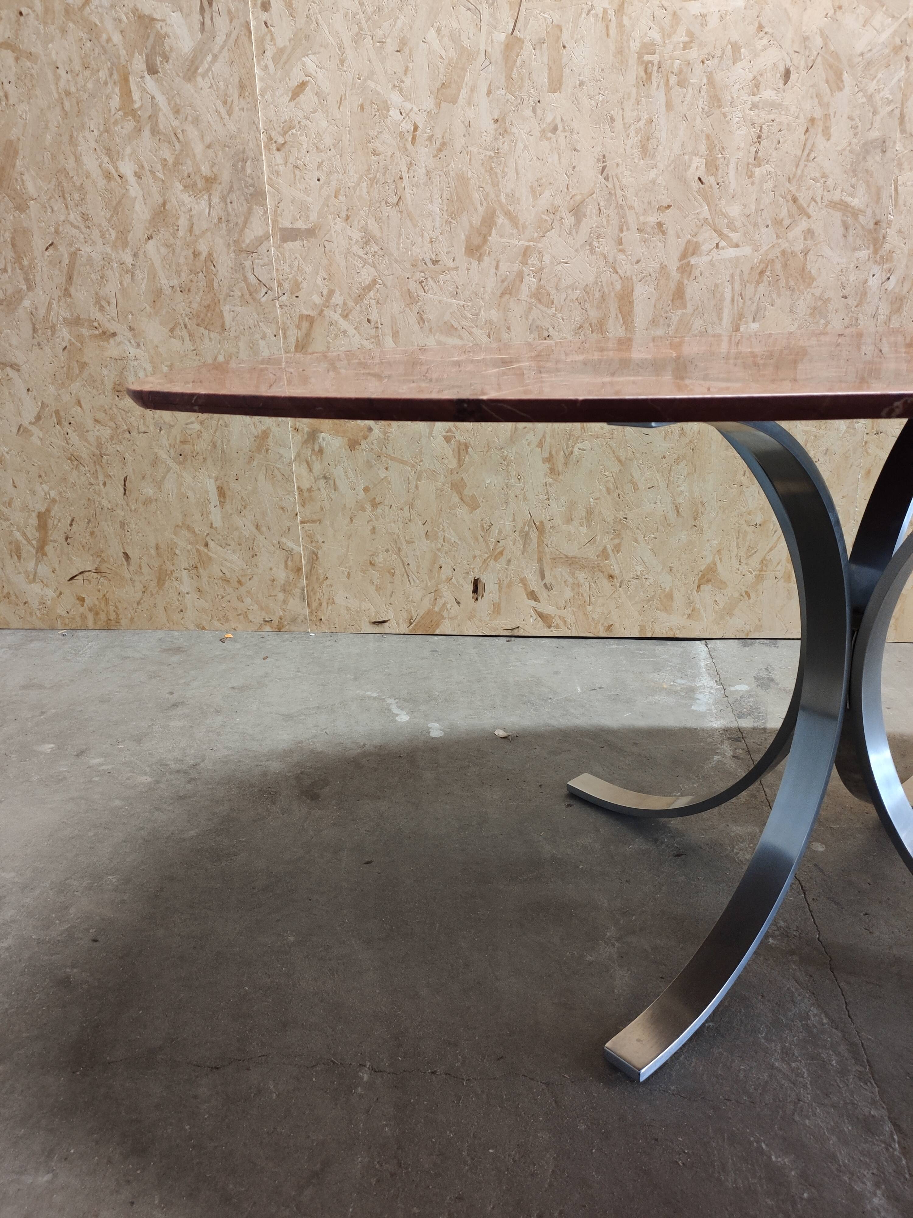 Oval dining table in red marble alicante techno