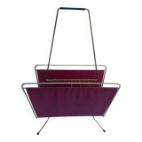 Vintage magazine rack in red skai with gold metal frame and plastic handle