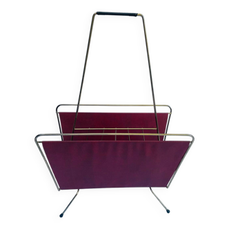 Vintage magazine rack in red skai with gold metal frame and plastic handle
