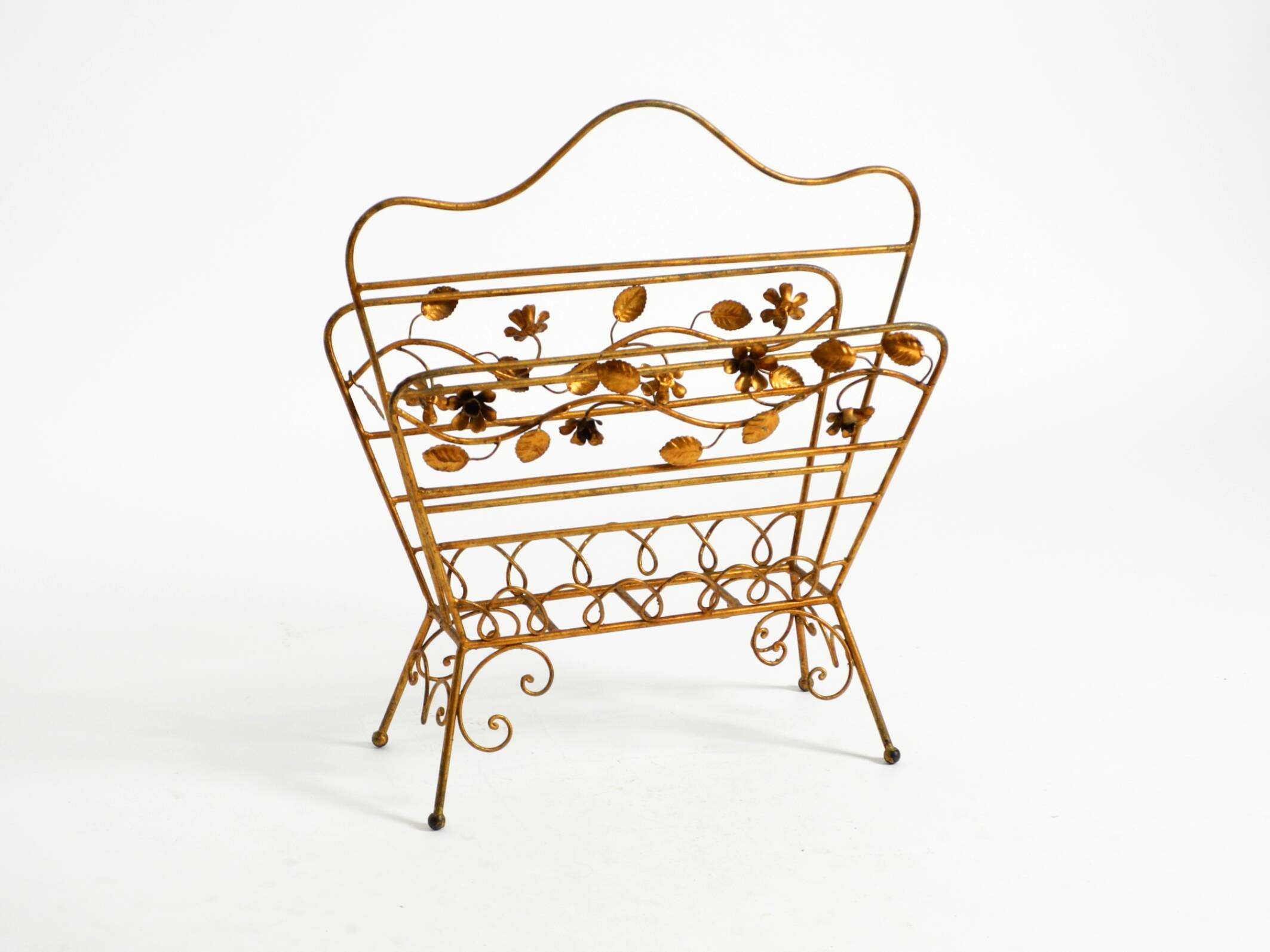 Extraordinary mid-century newspaper and magazine rack with a gilded metal