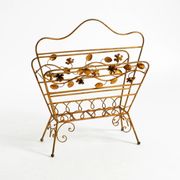 Extraordinary mid-century newspaper and magazine rack with a gilded metal