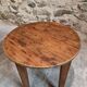 Antique round side table with oak legs and a pine top, circa 1900.