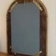 Miroir vintage en cuir clouté et laiton