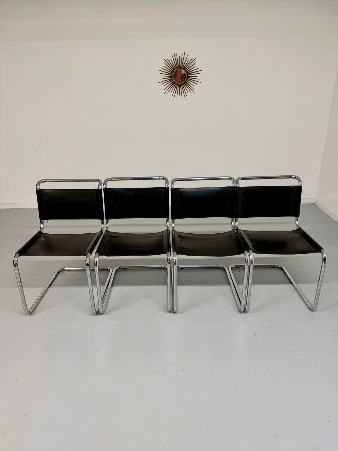 Lot of 4 tubular chairs designed by Mart Stam in vintage black leather from the 1980s.