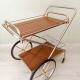 Rolling trolley in gold metal