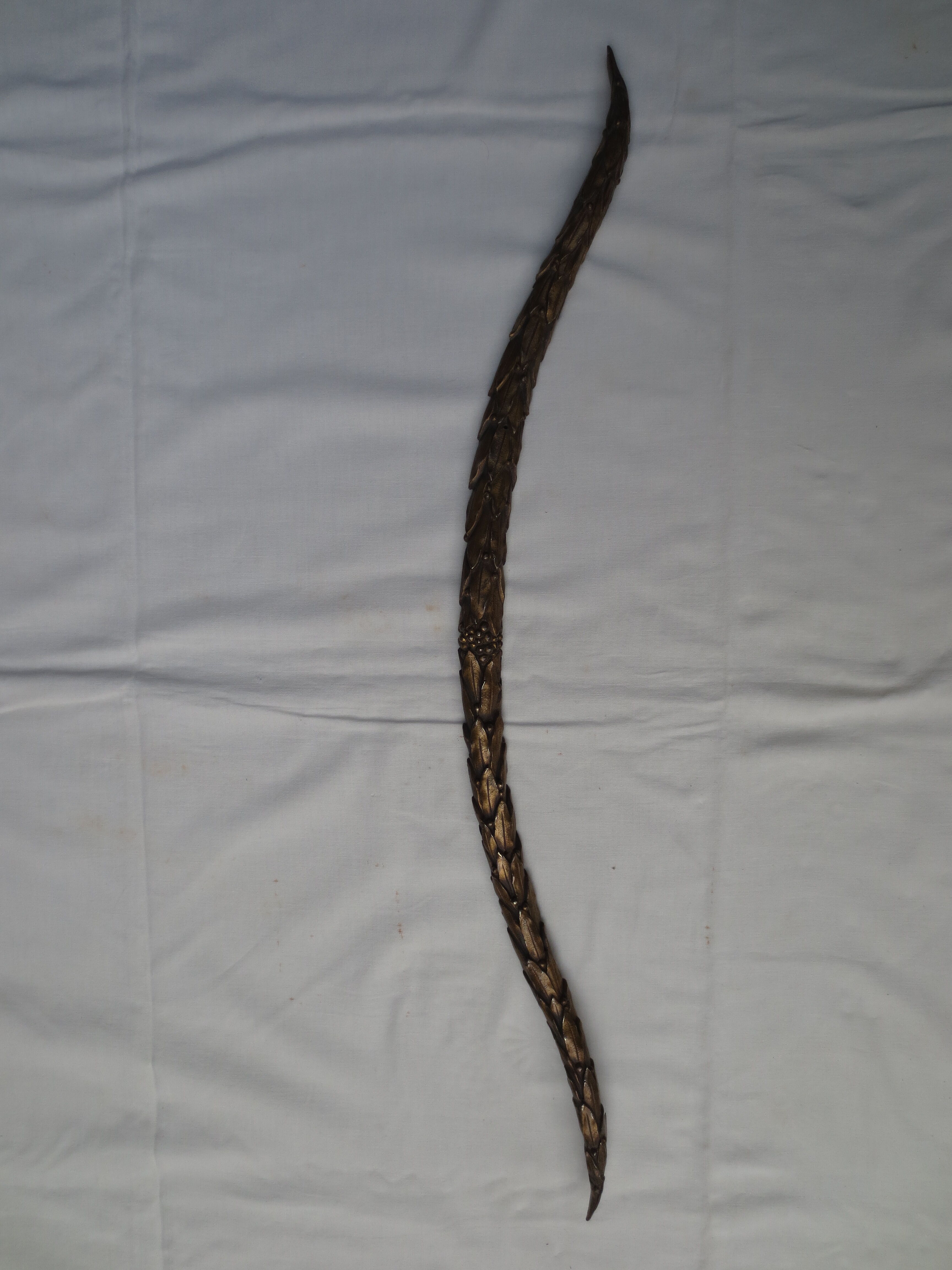 old bronze curved pediment