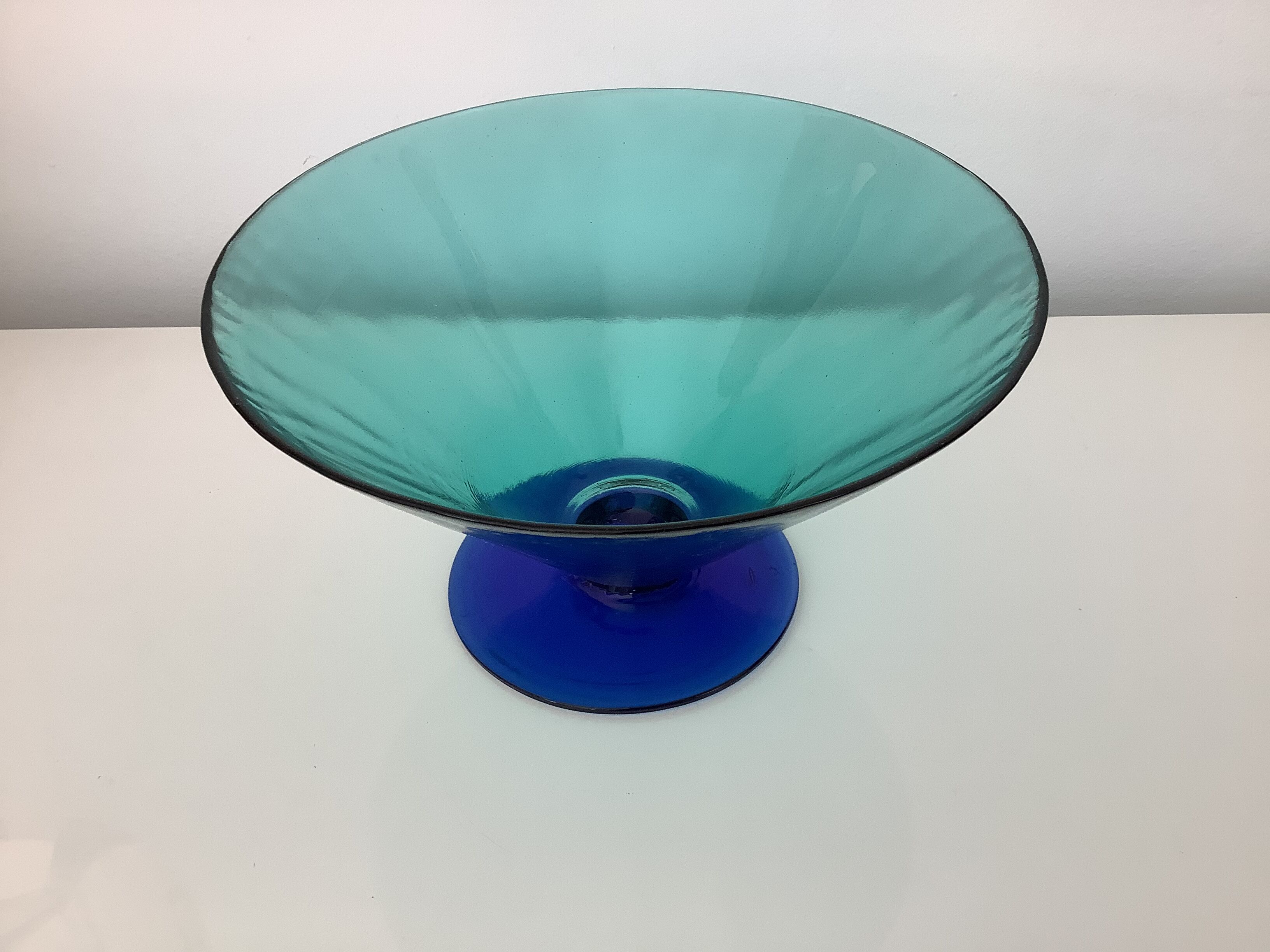 Glass fruit cup on foot, green and blue