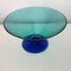 Glass fruit cup on foot, green and blue
