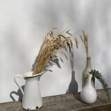 Old white enamelled metal pitcher