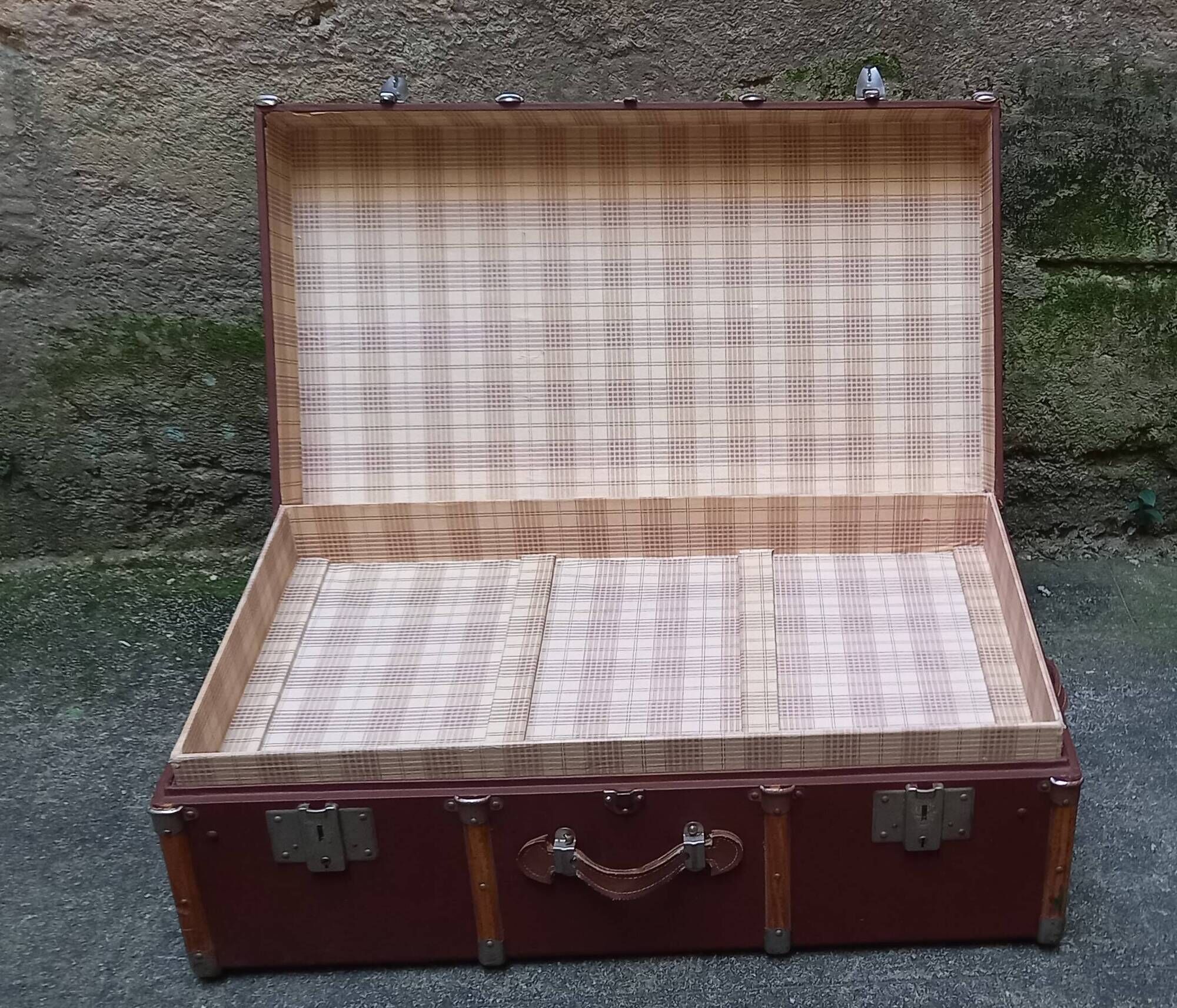 Old trunk, travel suitcase, with carrying handles and interior lockers, wooden reinforcements