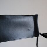 Vintage chrome and faux black leather armchair