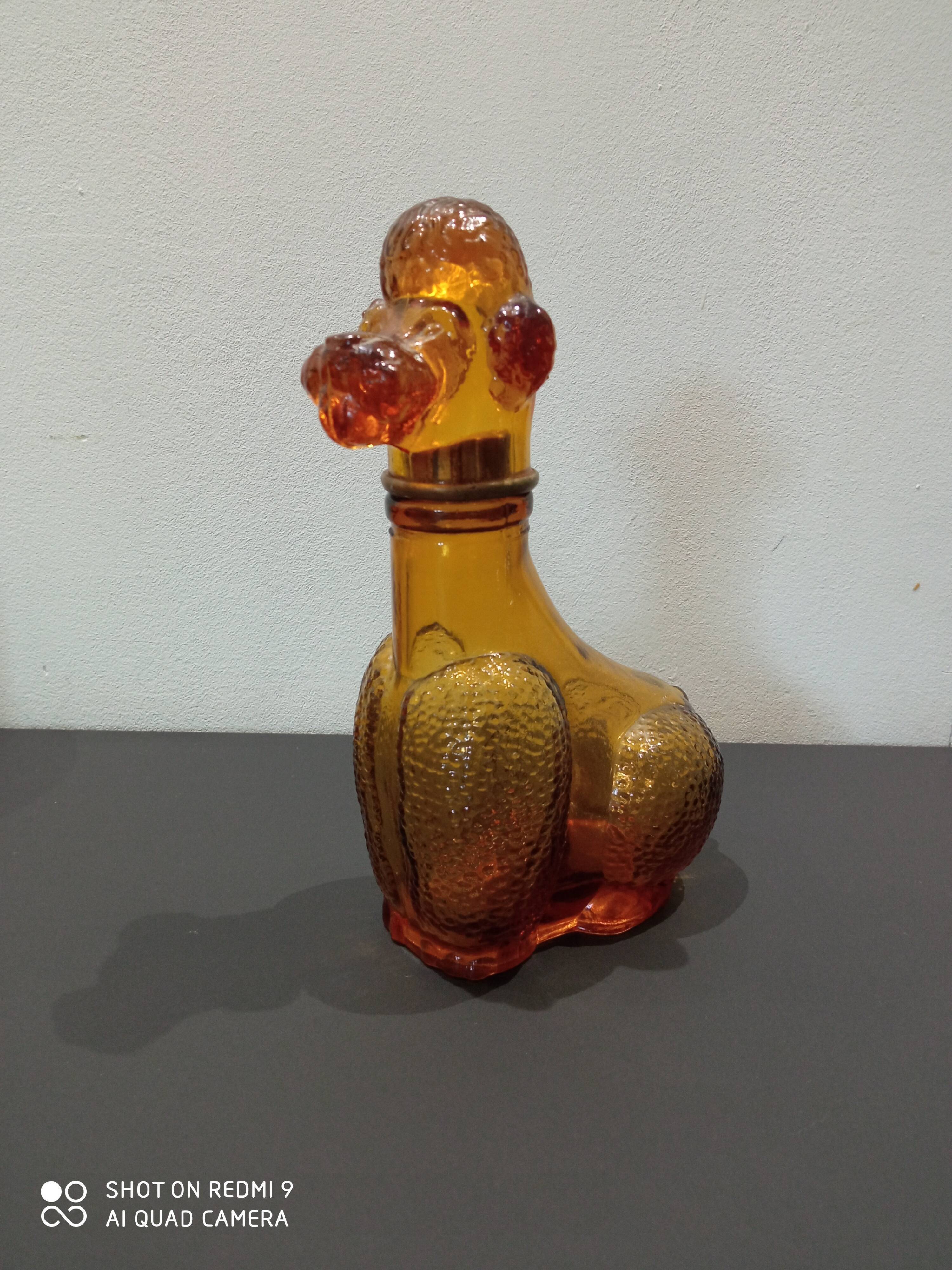 Old bottle in amber glass "poodle"