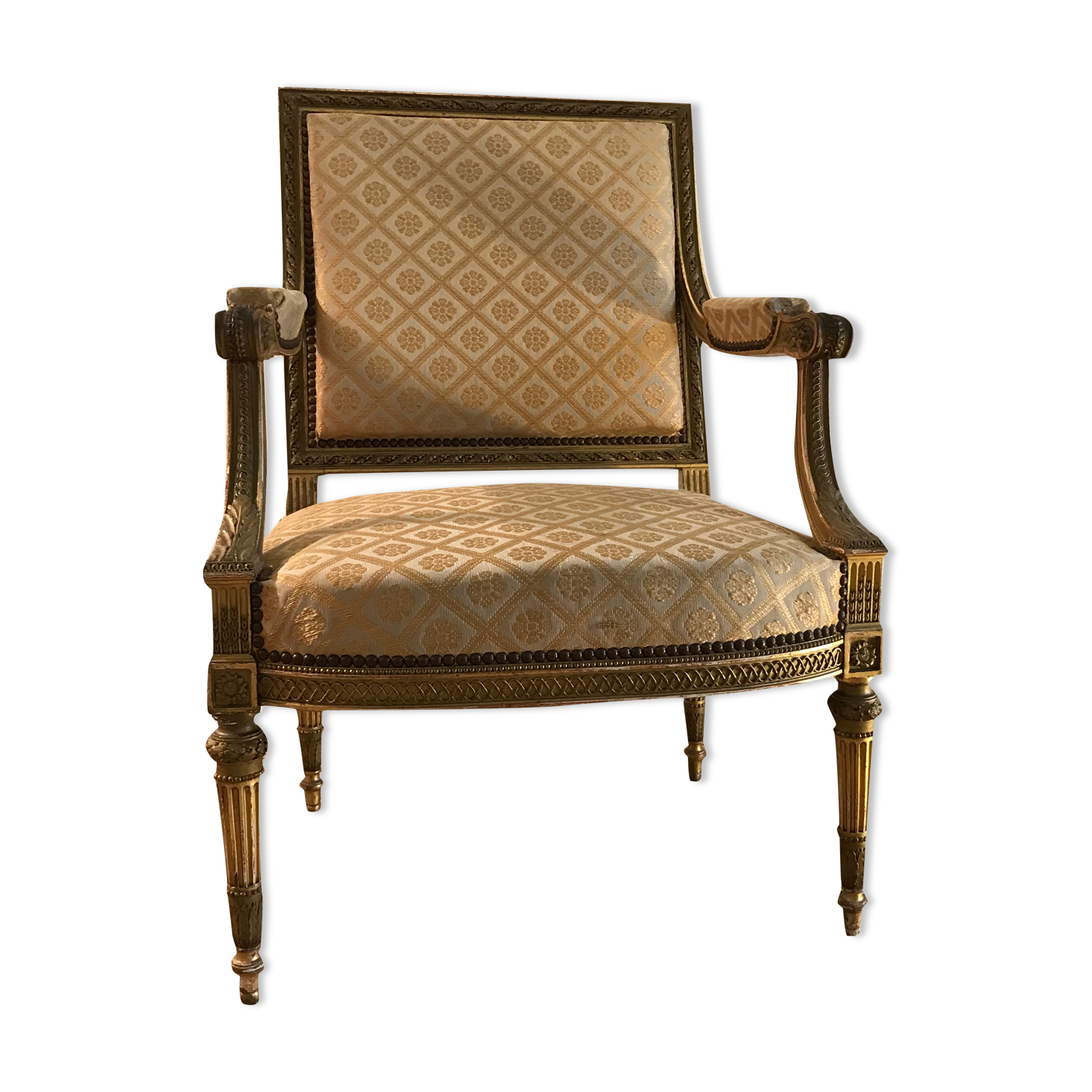Louis XVI armchair in gilded wood carved and molded
